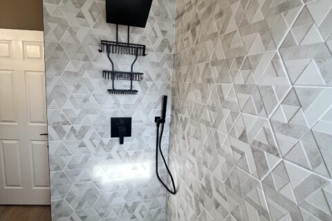 Custom Hexagonal Shower with Black Fixture Finish