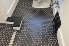 Modern Bathroom Remodel with Hexagon Tile and Linear Drain