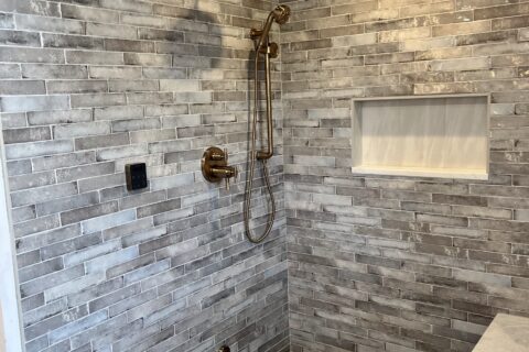Steam Shower with Porcelain Subway Tile and Linear Niche