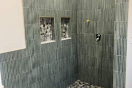 Kit Kat Tile Shower with Vertical Pattern and Pebble Floor